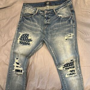 Distressed Blue Jeans with Patterned Patches